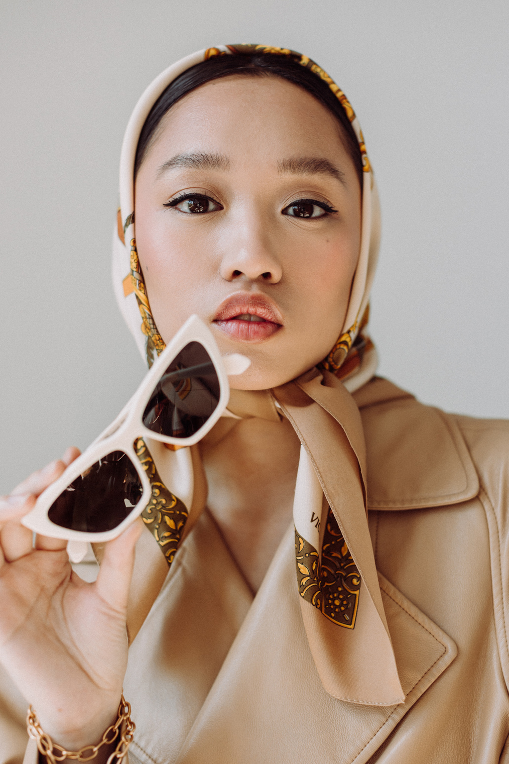 Stylish Woman in Coat, Scarf and Sunglasses